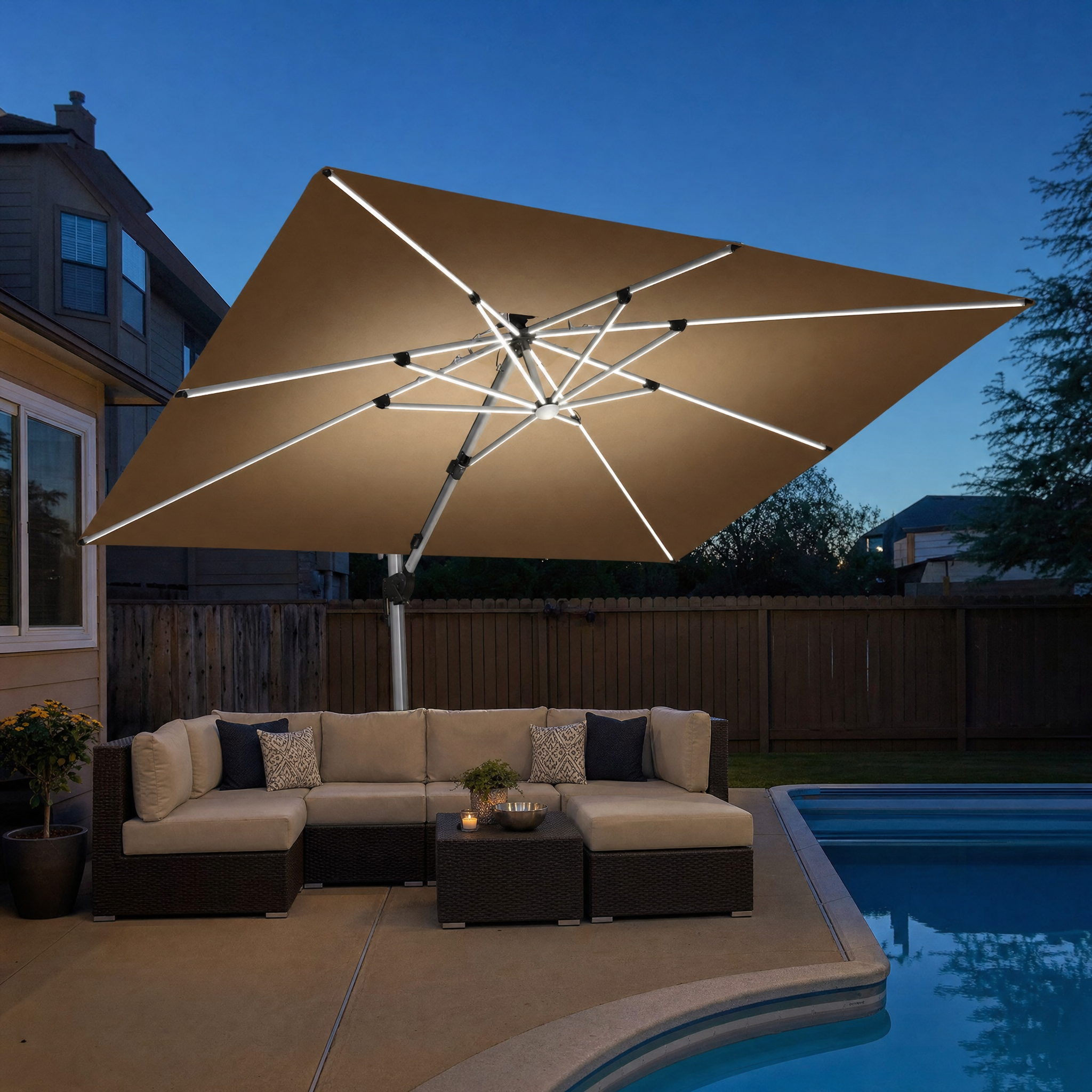 Tan rectangular cantilever umbrella with LED rib strips and grey pole at dusk