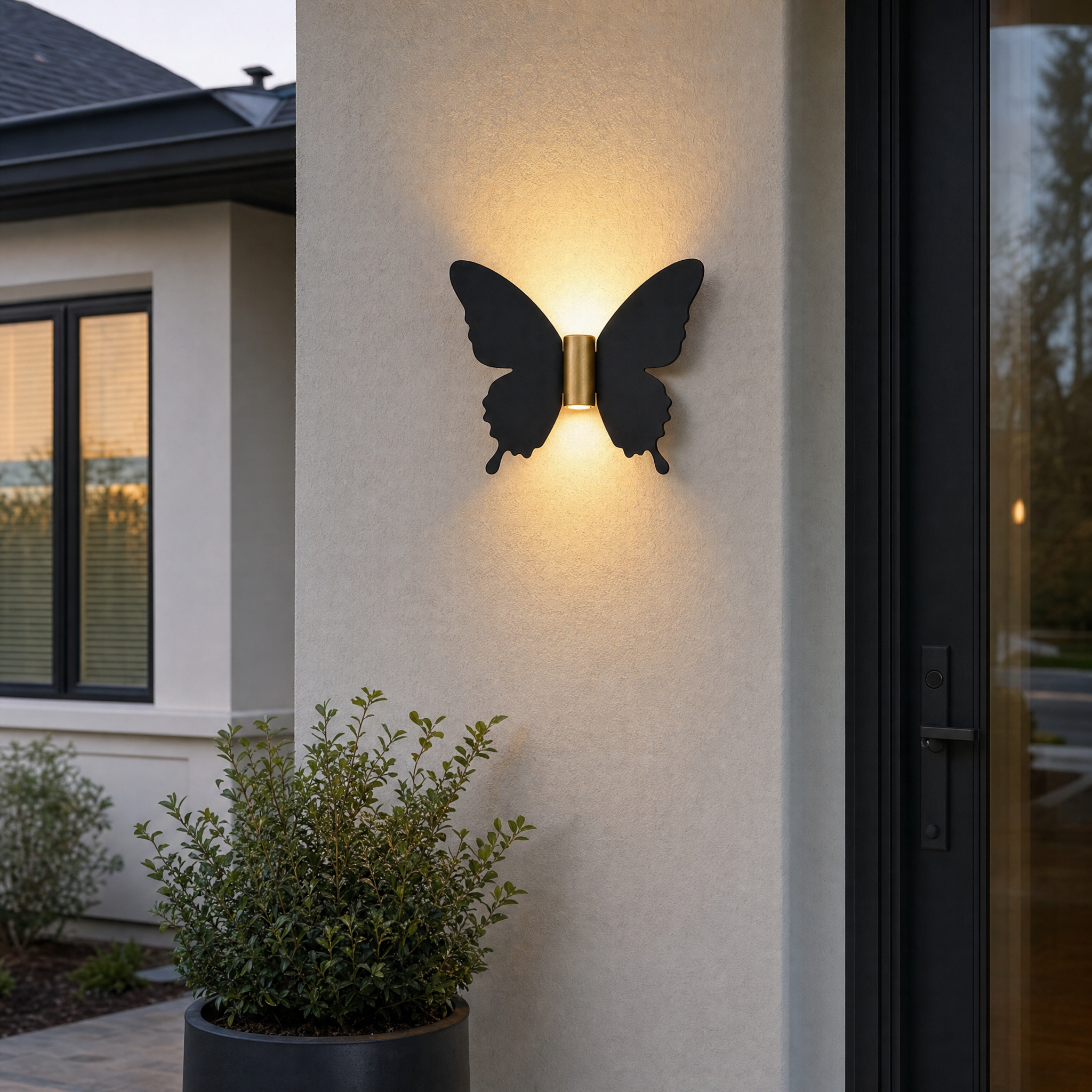 Butterfly wall light at modern home front entry at dusk