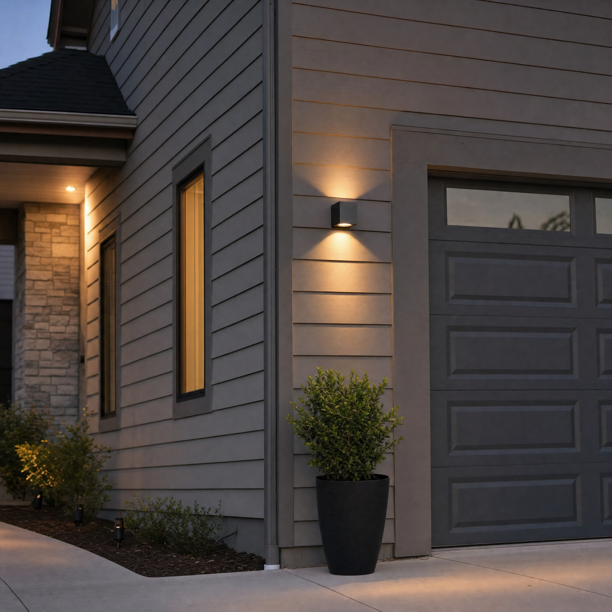 Square up and down wall washer by garage at dusk