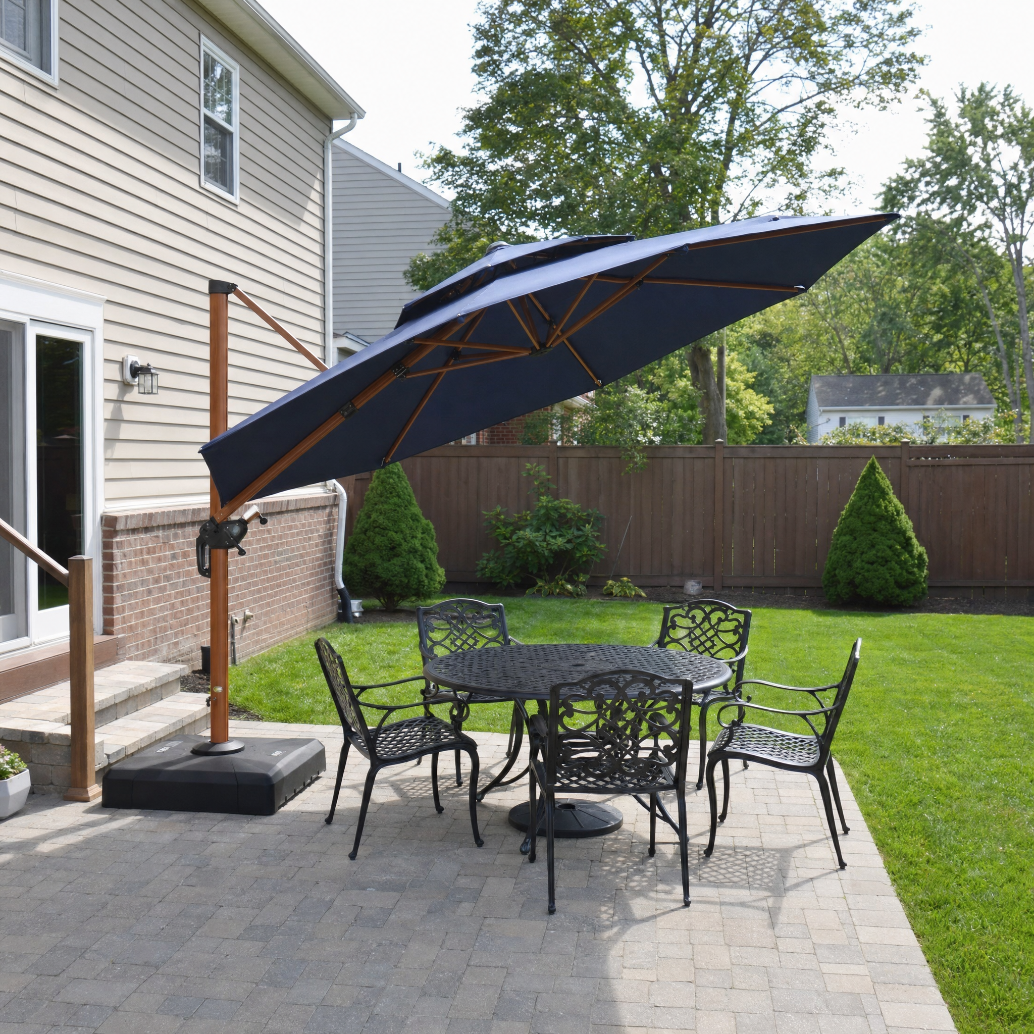 Navy round double-top cantilever umbrella with wood-grain pole over dining set