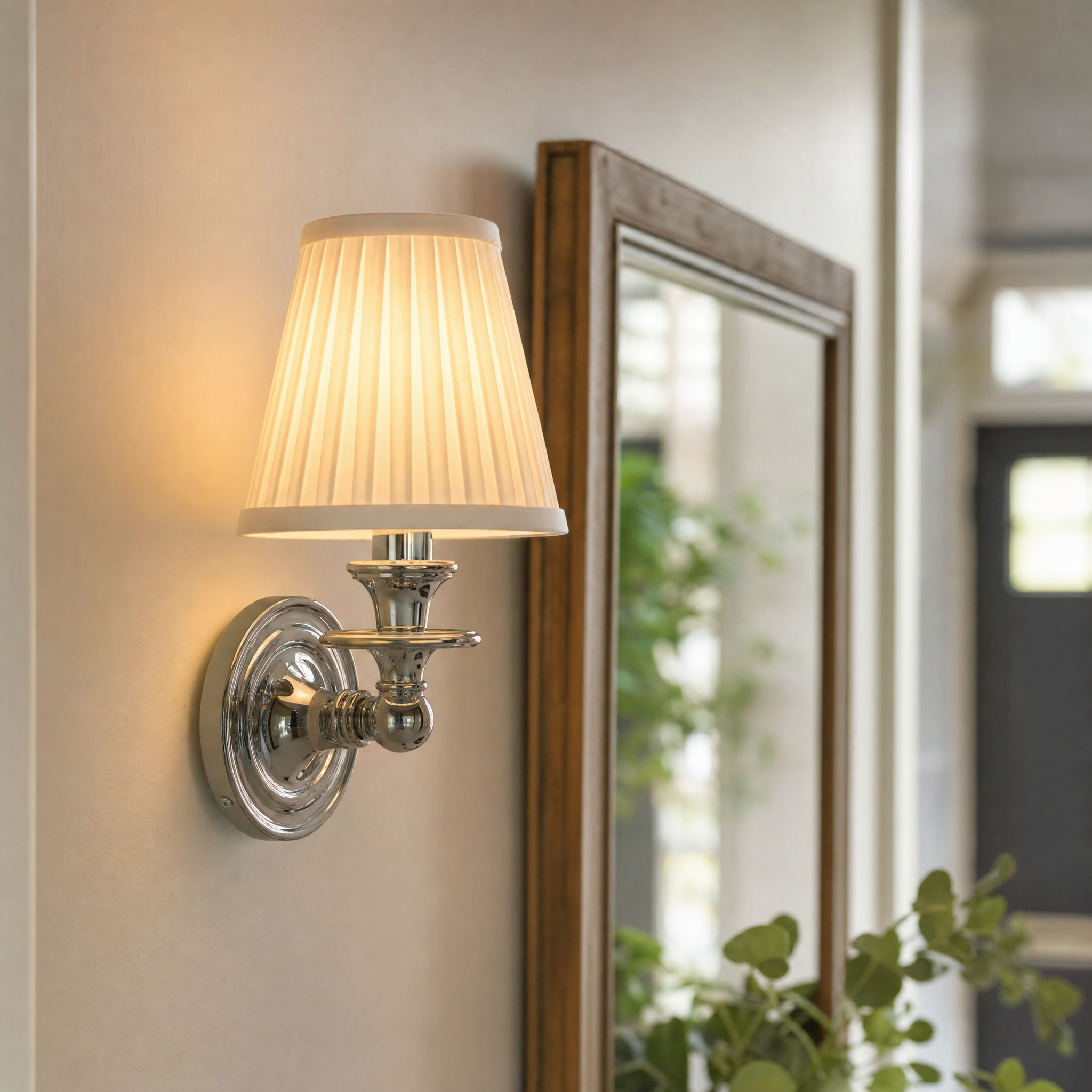 Rowan drum shade wall sconce mounted beside mirror in cottage entryway